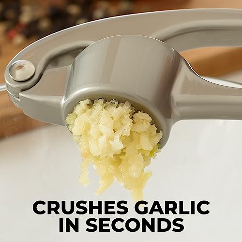 Zulay Kitchen Premium Garlic Press with Soft, Easy to Squeeze Handle - Includes Silicone Garlic Peeler & Cleaning Brush - 3 Piece Garlic Mincer Tool - Sturdy Easy to Clean Garlic Crusher (Silver)